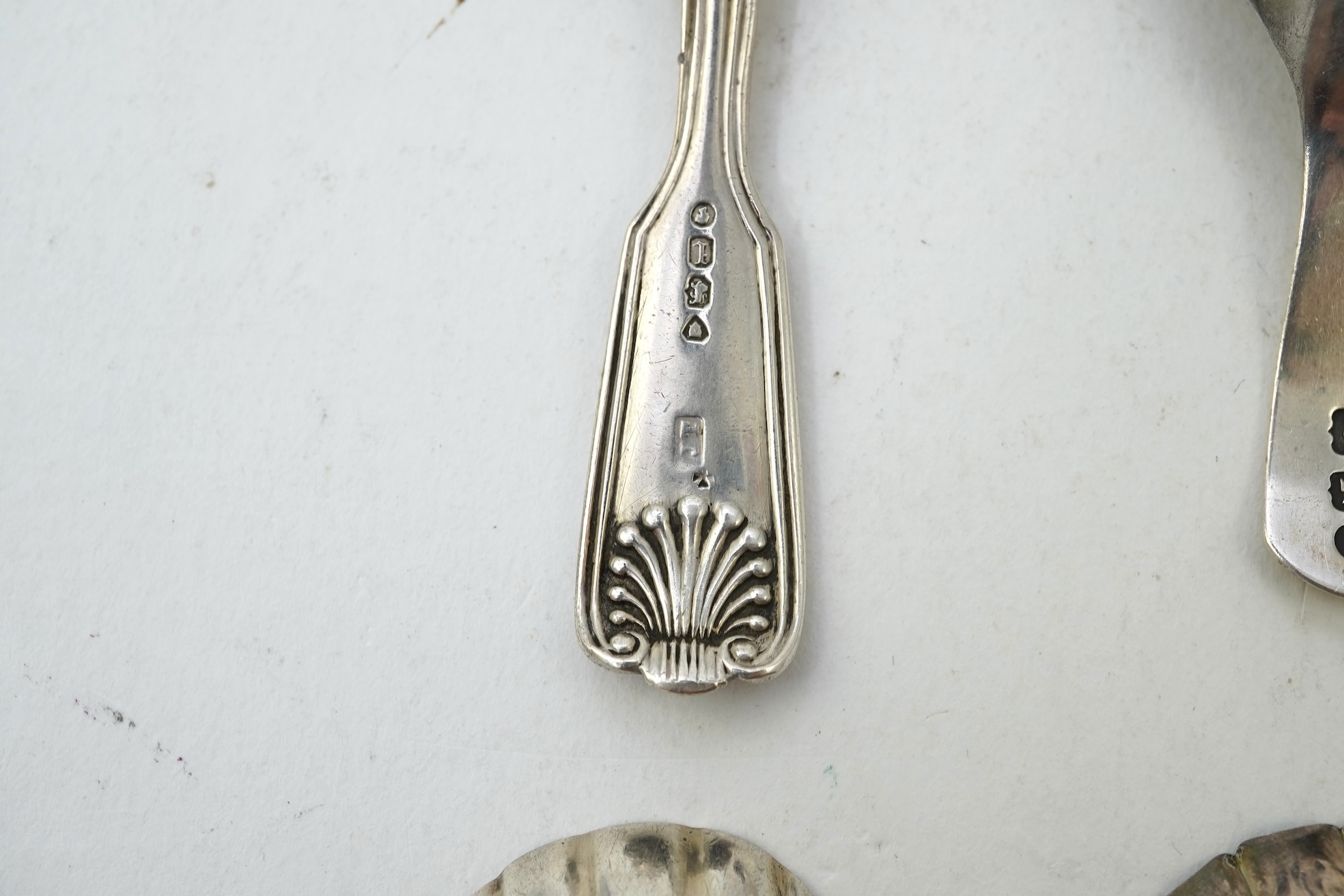 Ten assorted 19th and 20th century silver caddy spoons, with shell or fluted bowls